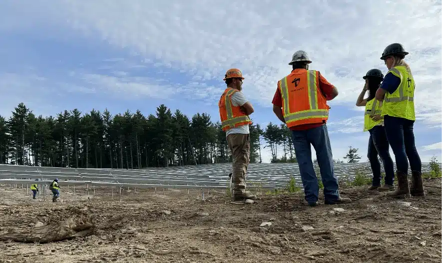 Terrasmart's team planning and installing ground mount racking on a solar site.